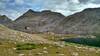 Odyssey Peak (12,062 ft.) on the Continental Divide, rises above Bewmark Lake and its surrounding alpine meadows.