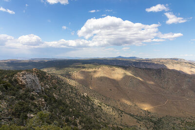 Clouds above the Scodie Mountains with Horse Canyon Road ahead.