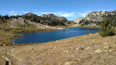 Palmer Lake. Looking north from the south end of the lake. The notch (right center) reveals distant cliffs of the Reynolds Creek canyon.